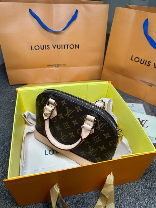 Bolsa de mão Louis Vuitton Alma BB monograma PVC couro marrom